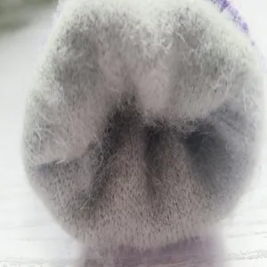 Thick fleece lined winter knitted gloves detail showing soft cozy interior warmth plush fabric