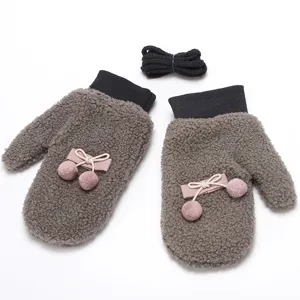 Winter warm plush mittens for women, thick fleece lined gloves with cute pom poms and cord.