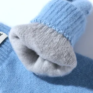 Detailed view of women's thick warm winter knitted mittens with cozy fleece inner lining.