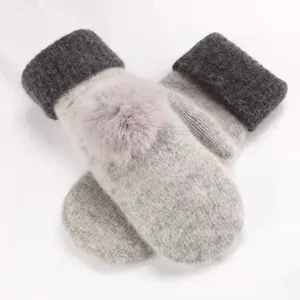 Women's winter thick knit mittens with fuzzy pom-pom, cute warm fleece-lined design for cold weather.