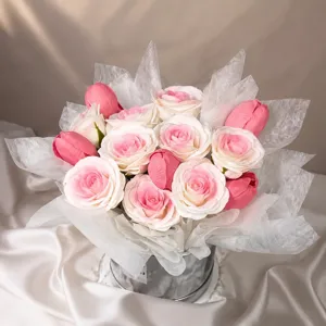 Artificial rose tulip bouquet in gift bucket, pink white floral arrangement for home decor.