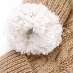 Thick cable knit winter glove detail view featuring soft white fluffy fleece lining texture