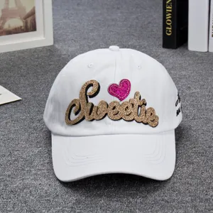 White baseball cap for women with glitter sweetie letter embroidery and pink heart.