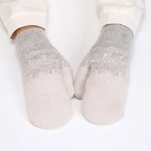 Soft plush winter mittens detail, warm rabbit hair knit gloves with cozy snowflake pattern.