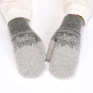 Winter plush mittens detail showing soft grey fluffy texture and knit snowflake pattern.