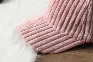 Close-up detail of a pink corduroy baseball cap visor showing texture and fabric.