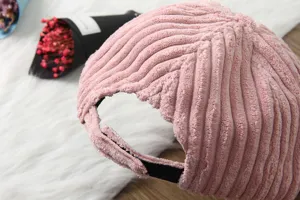 Corduroy baseball cap detail view, soft pink winter hat back design, cozy texture.