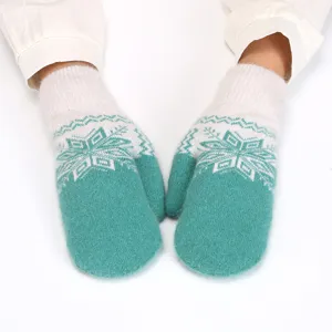 Cozy winter fleece-lined mittens for women, cute snowflake knit pattern, warm soft fuzzy gloves.