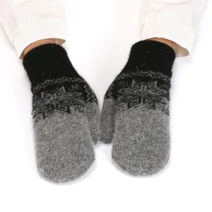 Fluffy winter warm mittens with classic snowflake pattern, soft knitted material for cold days.