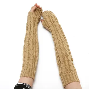 Close-up detail of cable knit long fingerless arm warmers in solid khaki, cozy winter sleeve.