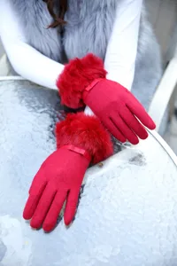Women winter warm red knit touch screen gloves with plush fur cuffs and bow detail.