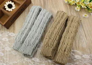 Detailed view of knitted fingerless arm warmers, winter warm long sleeves in solid color.