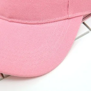 Detailed close-up view of pink cotton empty top sun hat brim stitching and soft fabric texture.