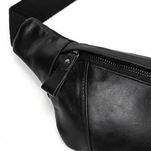 Detail view of the men's genuine leather chest bag, showing fine texture, zipper and strap.