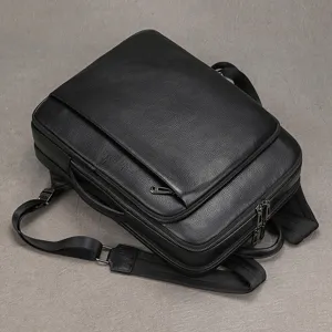 Black genuine leather business backpack for men, premium pebble texture computer rucksack.