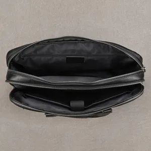 Bolso de negocios de cuero genuino para hombre maletín compartimentos internos detalle.