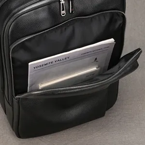Top-layer cowhide men business laptop backpack detail view, premium black leather rucksack.