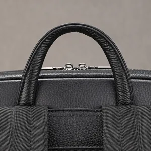 Close-up of the premium leather handle and details of the men's business backpack.