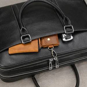 Premium black leather business briefcase for men, stylish top handle laptop bag with pockets.