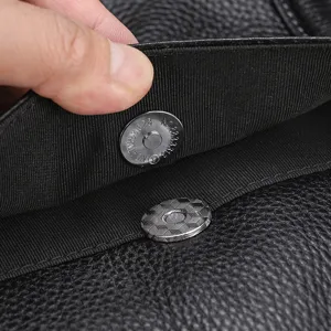 Men leather briefcase detail shot showcasing durable magnetic snap closure and premium leather.
