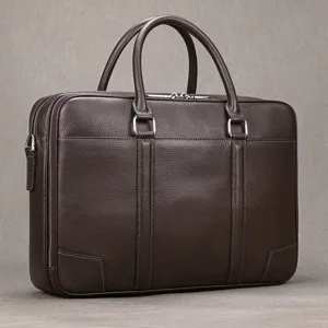 Premium brown leather business briefcase for men, large capacity laptop bag with sturdy handles.