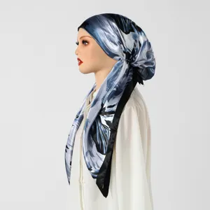 Satin printed headscarf cap detail view, elegant blue abstract floral design fashion hijab.