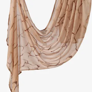 Close-up of the elegant beige rayon scarf featuring unique brown crackle print details.