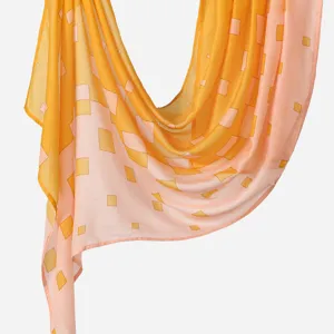 Close-up detail of the soft rayon gradient scarf featuring stylish geometric square prints.