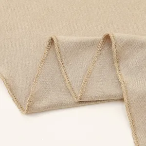 Detailed view of soft mercerized cotton hijab fabric with delicate overlock stitching.