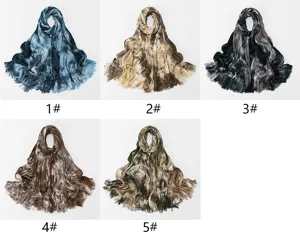 Detailed view of lightweight gradient tie-dye wrinkled long scarves with fringe, rayon fashion shawls.