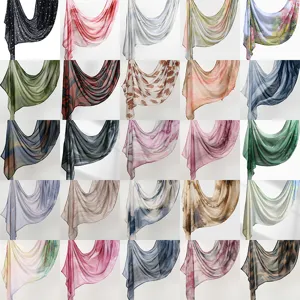 Detailed view of assorted rayon printed long scarves showcasing various abstract and ethnic patterns.