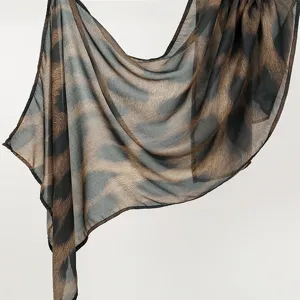 Close-up detail of the soft rayon animal print long scarf, showing fine texture and edges.