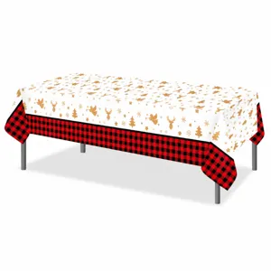 Christmas buffalo plaid tablecloth detail showing gold deer tree print on white PE material.