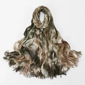 Lightweight gradient tie-dye crinkle scarf detail, soft rayon material with frayed edges.