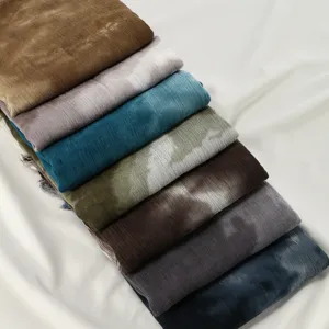 Detailed view of the ethnic style tie-dye cotton linen scarf showing texture and rich colors.