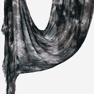 Detailed view of women tie dye wrinkled scarf showing soft fabric and draped texture.