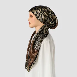 Satin leopard print headscarf detail view, showing smooth fabric texture and exquisite pattern design.