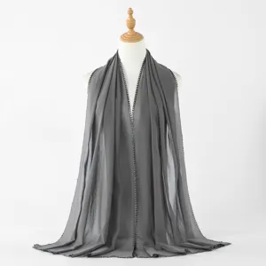Solid color chiffon long scarf detail featuring delicate heart edge trim, elegant grey shawl.