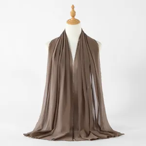 Details of the solid brown chiffon long scarf with a delicate heart lace edge for women.