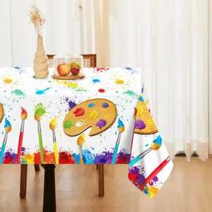 Art watercolor style tablecloth detail, colorful paint splatter pattern for party decor.