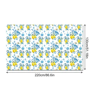 Blue and white lemon pattern tablecloth detail view, waterproof decorative party table cover.