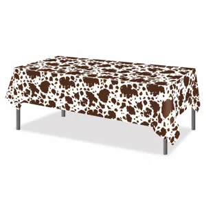 Brown cow print PE disposable tablecloth detail, ideal for farm themed birthday party decor.