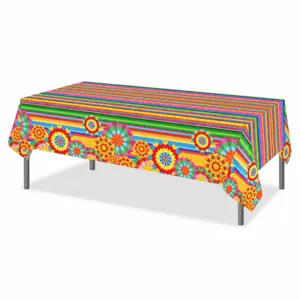 Close-up detail of colorful Mexican fiesta striped pattern floral party tablecloth surface.
