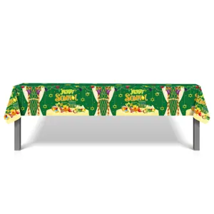 Sukkot tablecloth detail showing green festive design with holiday symbols and text.
