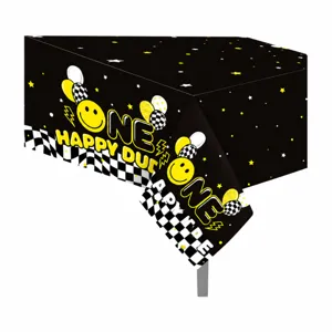 Vista detallada del mantel de fiesta PE negro con diseño smiley para el primer cumpleaños.