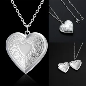 Silver heart locket pendant necklace with floral embossed pattern and cross chain for women