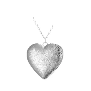Silver heart locket necklace with vintage floral engraved pendant and delicate cross chain.