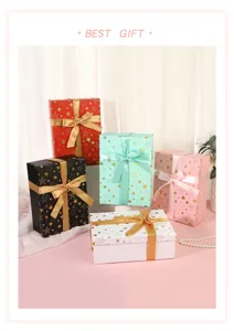 Detail view of colorful star pattern gift boxes with elegant ribbon bows for festive occasions.