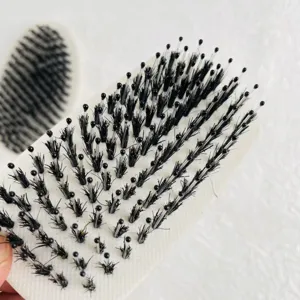 Close-up detail view of mens beard brush with soft black boar bristles and cushion base.