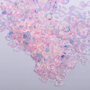 Detail shot of holographic pink heart sequins for epoxy resin crafts and DIY decoration.